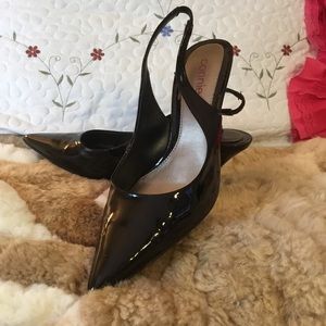 Black patent sling back pointy heels.